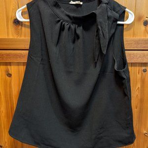 Sleeveless black top with tie